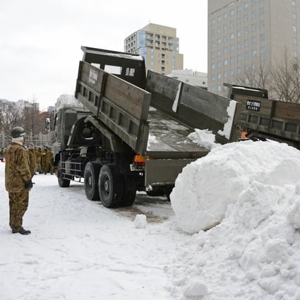 The city of Sapporo has ordered trucks to carry in snow for its annual festival due to reduced snowfall. Photo: Kyodo