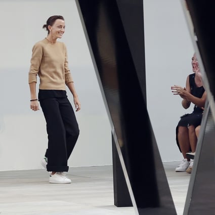 Phoebe Philo sports trainers as she takes a bow at the end of the Celine 2015 spring/summer show in Paris on September 28, 2014. Photo: Francois Guillot/AFP via Getty Images