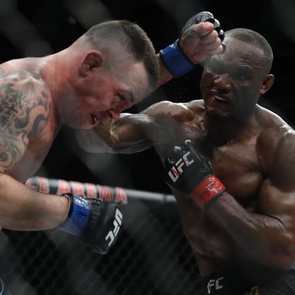 Colby Covington gets hit with a punch from UFC welterweight champion Kamaru Usman. Photo: AFP