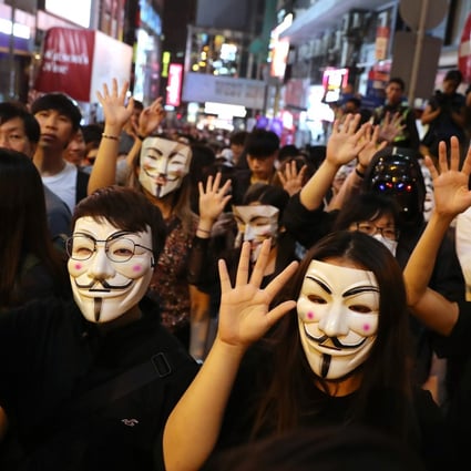 People wearing masks protest against the government’s Prohibition on Face Covering Regulation in Lan Kwai Fong, Central, on October 31, 2019. Photo: Sam Tsang