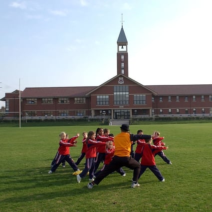 Pupils on the sports field at the Pudong campus of the Dulwich College in Shanghai on 30 December 2004. Photo: Handout.