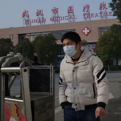 A man leaves the Wuhan Medical Treatment Centre, where some of the patients have been treated. Photo: AFP
