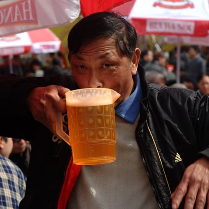 A Vietnamese man drinking during a local beer festival in Hanoi. Photo: AFP
