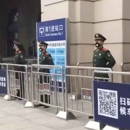 Hankou railway station in Wuhan is guarded after being closed down on Thursday. Photo: Weibo