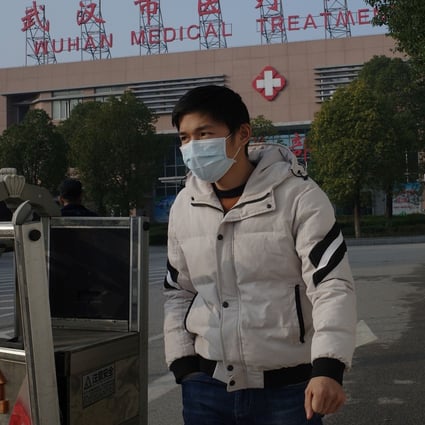 A man leaves a medical centre in Wuhan, where the coronavirus is thought to have originated. Photo: AFP