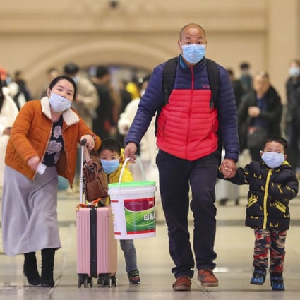 Travellers at Hankou Railway Station in Wuhan on January 21, 2020. The city’s airport and rail station are packed as travellers desperately try to get out of city at the epicentre of the outbreak. Photo: AP