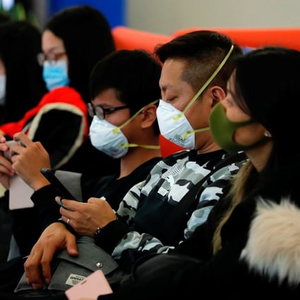 Passengers wear masks at the West Kowloon high-speed railway station as Hong Kong braces itself for a potential mass outbreak of a new coronavirus. Photo: Reuters