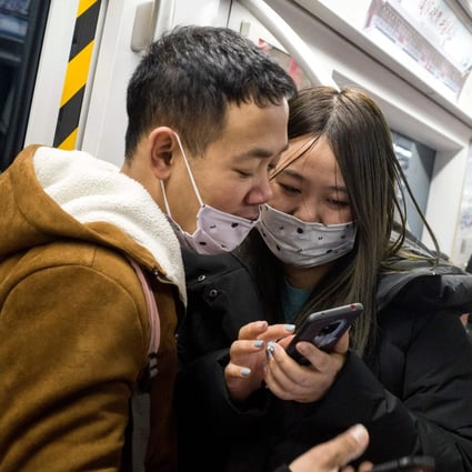 Subway passengers wear protective masks in Beijing on January 21, 2020. Photo: AFP