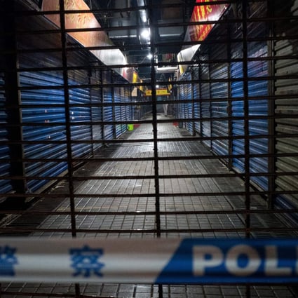 Members of the Wuhan Hygiene Emergency Response Team conduct searches in the shuttered Huanan Seafood Wholesale Market in Wuhan, Hubei province, on January 11. Photo: AFP