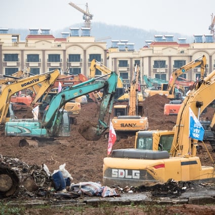 Dozens of excavators break ground for the new coronavirus facility in Wuhan, expected to be completed within six days. Photo: Xinhua
