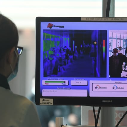 Passengers undergo thermal scanning on arrival at Singapore Changi Airport last week. Photo: Xinhua