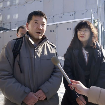 Hibiki Momose (centre), a Hokkaido University of Education professor, leads a group in the submission of a petition to the Chinese consulate general asking it to help bring back Chinese scholar Yuan Keqin, whose whereabouts have been unknown for more than six months. Photo: Kyodo