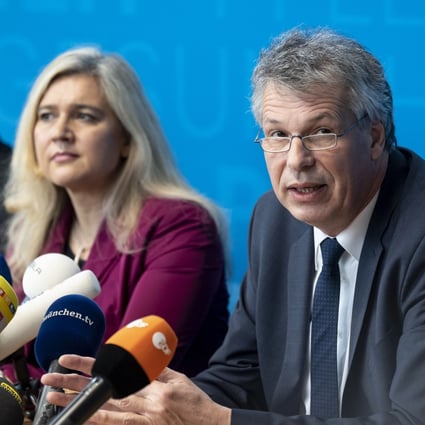 President of the Bavarian state office for health and food safety, Andreas Zapf (third left) and Bavarian Health Minister Melanie Huml (centre) speak during a news conference to confirm a German case of coronavirus. Photo: EPA-EFE
