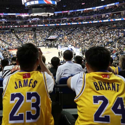 Los Angeles Lakers fans in LeBron James and Kobe Bryant jerseys watch the NBA China Games 2019 in Shanghai. Photo: Reuters