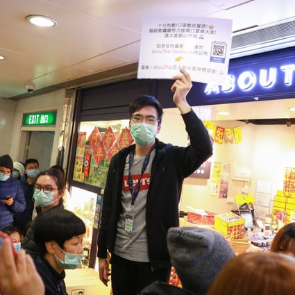 A crowd throngs an outlet for masks at Kornhill Plaza in Taikoo Shing. Photo: May Tse