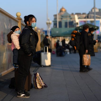 Passengers arriving at Beijing Railway Station on Thursday after the Lunar New Year holiday wear masks. The coronavirus outbreak is developing into China’s biggest health scare since the Sars epidemic in 2003. Photo: AP