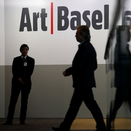 A guest attends a reception for Art Basel Hong Kong. Hong Kong art galleries have criticised counterparts overseas who have called on organisers to cancel the fair for misrepresenting the situation in Hong Kong. Photo: Reuters