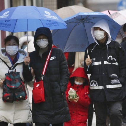 Tourists in Tokyo were taking precautions as the number of coronavirus infections worldwide approached the global total for the Sars outbreak. Photo: AP