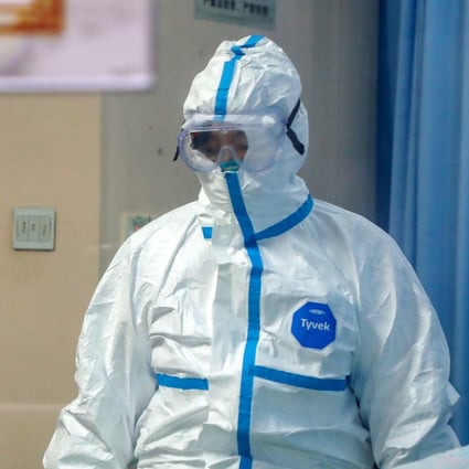 A doctor checks on a patient in the isolation ward of a hospital in Wuhan, Hubei province, on Thursday. Photo: EPA-EFE