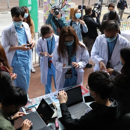 Medical workers strike near Queen Elizabeth Hospital demanding Hong Kong close its borders with mainland China to curtail the spread of the coronavirus. Photo: Winson Wong