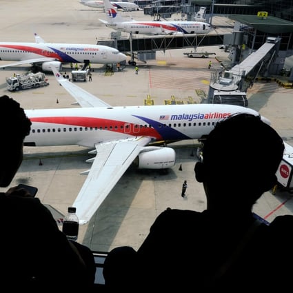 Malaysia Airlines aircraft stand on the tarmac at Kuala Lumpur International Airport on Tuesday. Photo: Bloomberg
