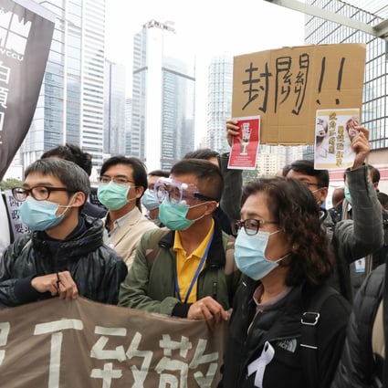 Hospital Authority workers raise protest slogans outside government headquarters. Photo: Nora Tam