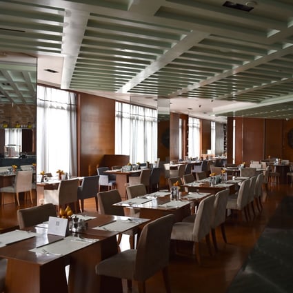 This hotel cafe is deserted as tourists stay away from mainland cities amid the coronavirus outbreak. Photo: AFP