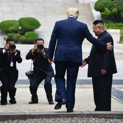 US President Donald Trump meets Kim Jong-un in the demilitarised zone between the two Koreas. Photo: AFP