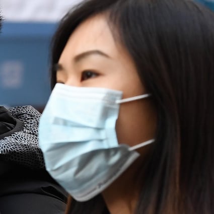 People wearing face masks in London. Photo: EPA