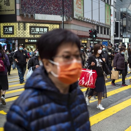 Pedestrians wearing protective masks in Causeway Bay. Hong Kong reported a death from the coronavirus and 42 infections as of Tuesday. Photo: Warton Li