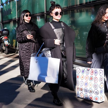 Asian fashion bloggers fit in some shopping while attending fashion week in Milan last spring. The absence of fashion influencers, buyers and editors because of the coronavirus outbreak, and logistical problems it has caused, will keep six Chinese designer labels away from Paris Fashion Week this spring. Photo: Shutterstock