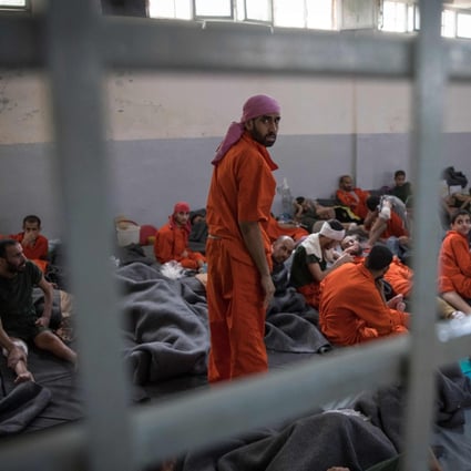 Men allegedly affiliated with the Islamic State (Isis) terror group in a Syrian prison in 2019. Photo: AFP