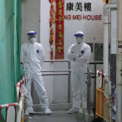 Health workers at Hong Mei House in Tsing Yi after two people in the block were confirmed to have contracted the coronavirus. Photo: Edmond So