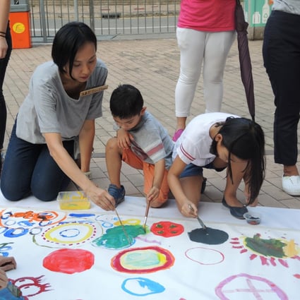 Hong Kong district councillor Clara Cheung creating artwork with children as part of her campaign leading up to November’s district council elections.