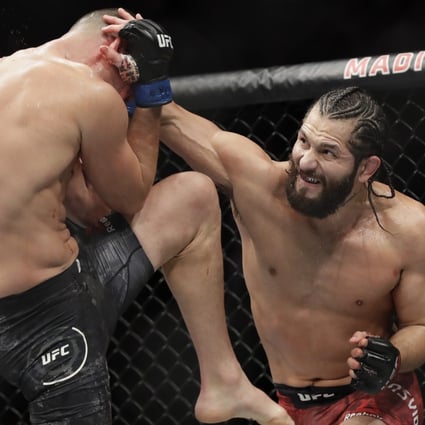 Jorge Masvidal punches Nate Diaz during the second round at UFC 244. Photo: AP