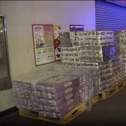 About 600 rolls of toilet paper were stolen from outside a supermarket in Mong Kok on Monday morning. Photo: Now TV
