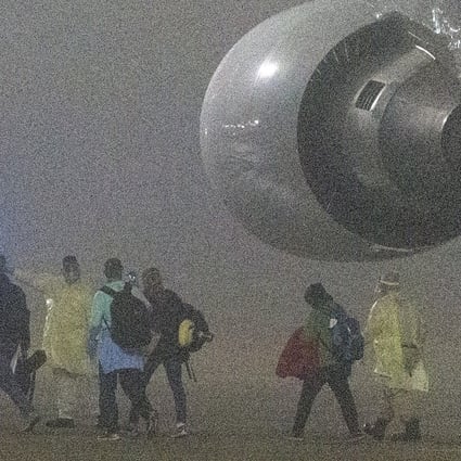American passengers evacuated from the Diamond Princess in Japan disembark from a plane in San Antonio, Texas early on Monday. Photo: San Antonio Express-News via AP