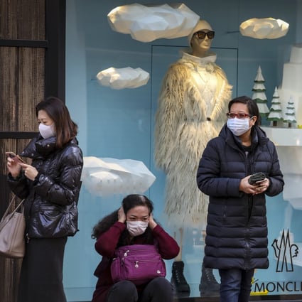 Queues for surgical masks are still forming around Hong Kong, though a new survey suggests they are slowly becoming easier to obtain. Photo: Nora Tam