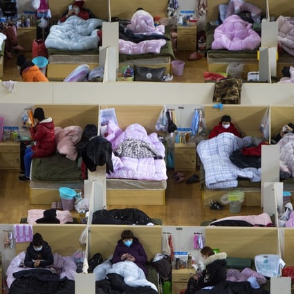Coronavirus patients are housed at a temporary hospital converted from a sports centre in Wuhan. Photo: AP