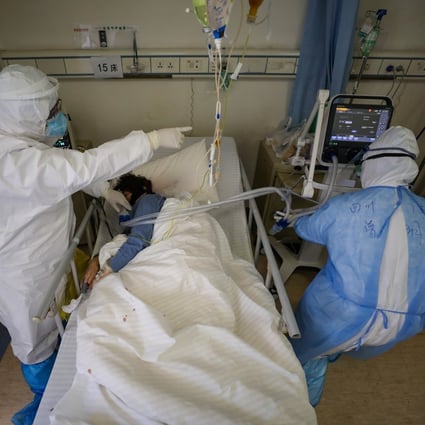 Medical workers attend to a patient in Red Cross Hospital in Wuhan, the epicentre of the novel coronavirus outbreak. Photo: Reuters