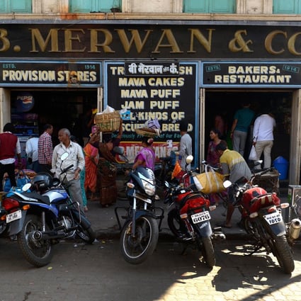 Mumbai's historic Irani cafes, like B. Merwan & Co, are slowly disappearing, but owners are determined to keep the tradition of rich and poor sitting side by side to eat Indian fast-food favourites. Photo: Hindustan Times via Getty Images