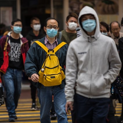 People wear face masks in Hong Kong, on February 9. Photo: AFP