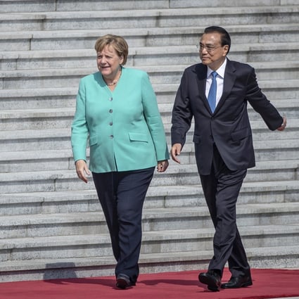 German Chancellor Angela Merkel (left) and Chinese Premier Li Keqiang meet in Beijing last year. Some observers say Merkel has been too keen to reach a deal with China. Photo: AP