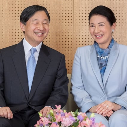 Japan's Emperor Naruhito and his wife Empress Masako smile at their residence in Tokyo, in this photo released ahead of his 60th birthday. Photo: AP
