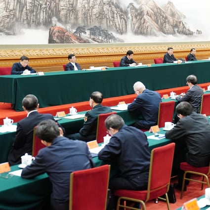 Communist Party and state leaders attend a meeting in Beijing on Sunday to advance the work on coordinating the prevention and control of the epidemic. Photo: Xinhua