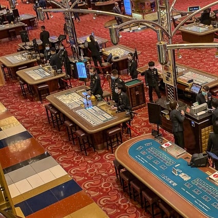 Macau casinos only began slowly opening at midnight Thursday after a 15-day shutdown over the coronavirus outbreak. Here, croupiers wait for gamblers at the Grand Lisboa. Photo: Handout
