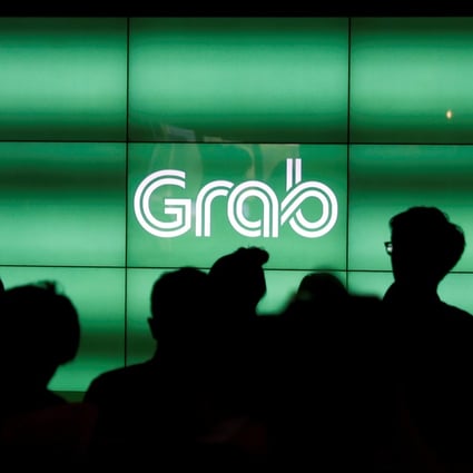 Ride-hailing provider Grab will co-develop a range of app-based financial products for Southeast Asia with its new investors, banking giant Mitsubishi UFJ Financial Group and data centre services firm TIS. Photo: Reuters