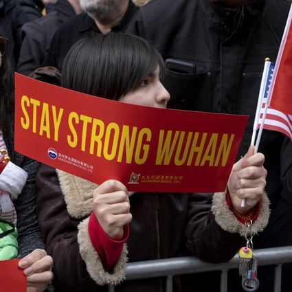 A sign of support for Wuhan during the Lunar New Year parade in New York City’s Chinatown on February 9. Wuhan natives in the US have rallied to donate medical supplies and other materials to their hometown. Photo: AP