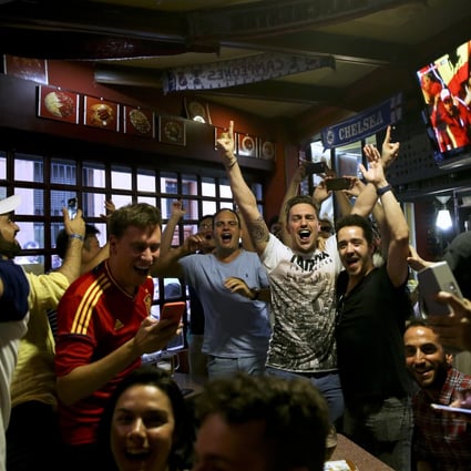 Spain fans watch the Russia 2018 World Cup match between Spain and Iran in a bar in Madrid. Photo: AP