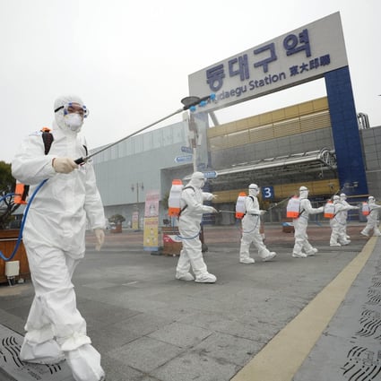 Quarantine officials in Daegu, South Korea, carry out a disinfection operation. Photo: YNA/DPA